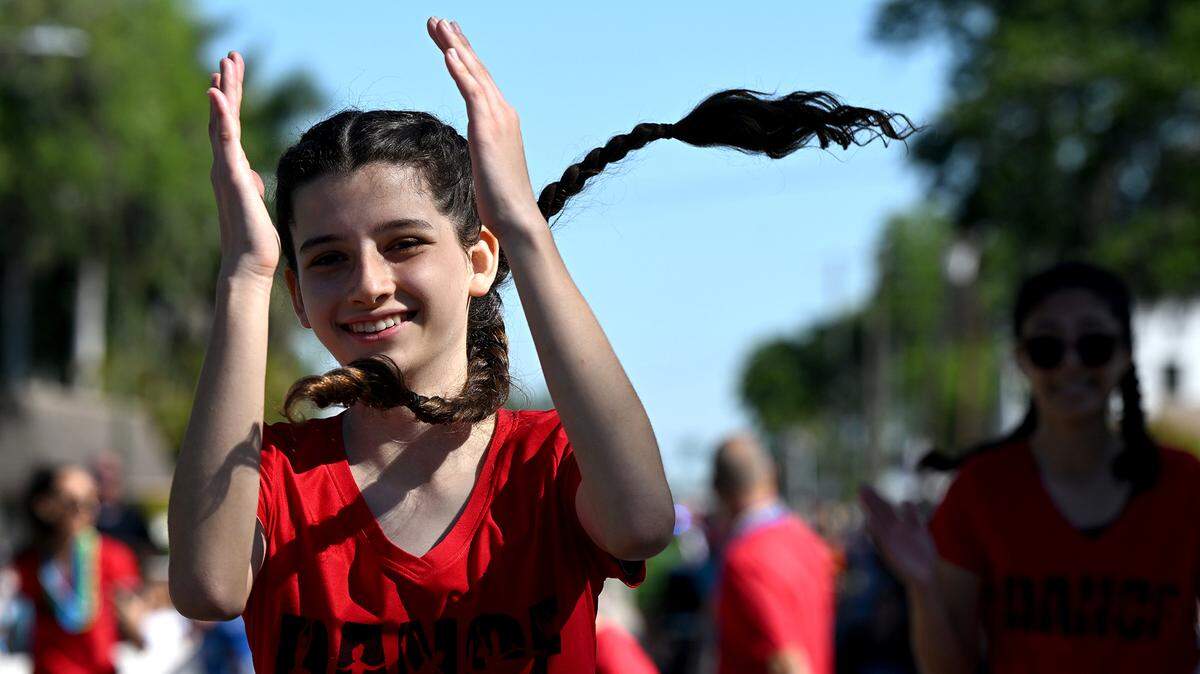 A dancer from Kingdom Arts Academy enjoys the parade at the Hernando De Soto Historical Society’s Children’s Parade in Palmetto on March 29, 2024.