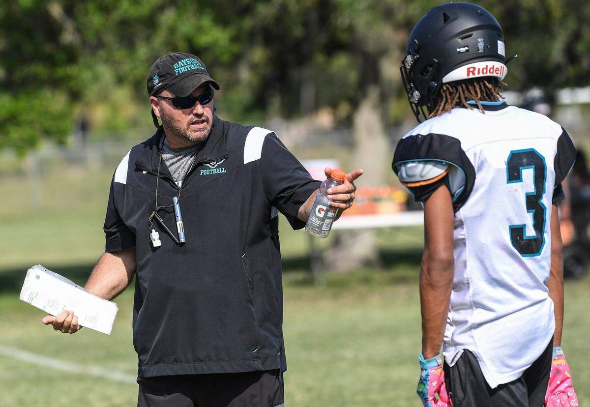Bayside football head coach Billy Miller instructs his players during practice Thursday, May 11, 2023. Craig Bailey/FLORIDA TODAY via USA TODAY NETWORK