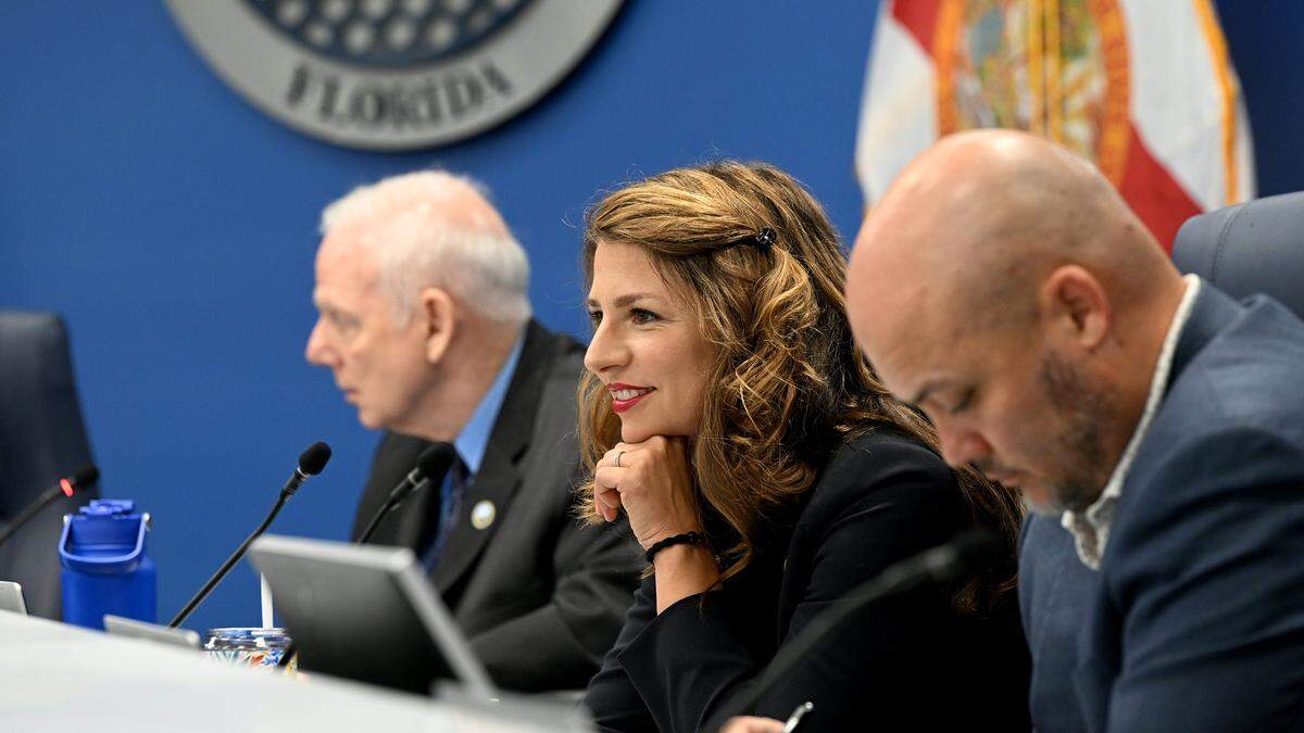 Commissioner Amanda Ballard smiles at a remark during a meeting of the Board of County Commissioners on July 29, 2025.