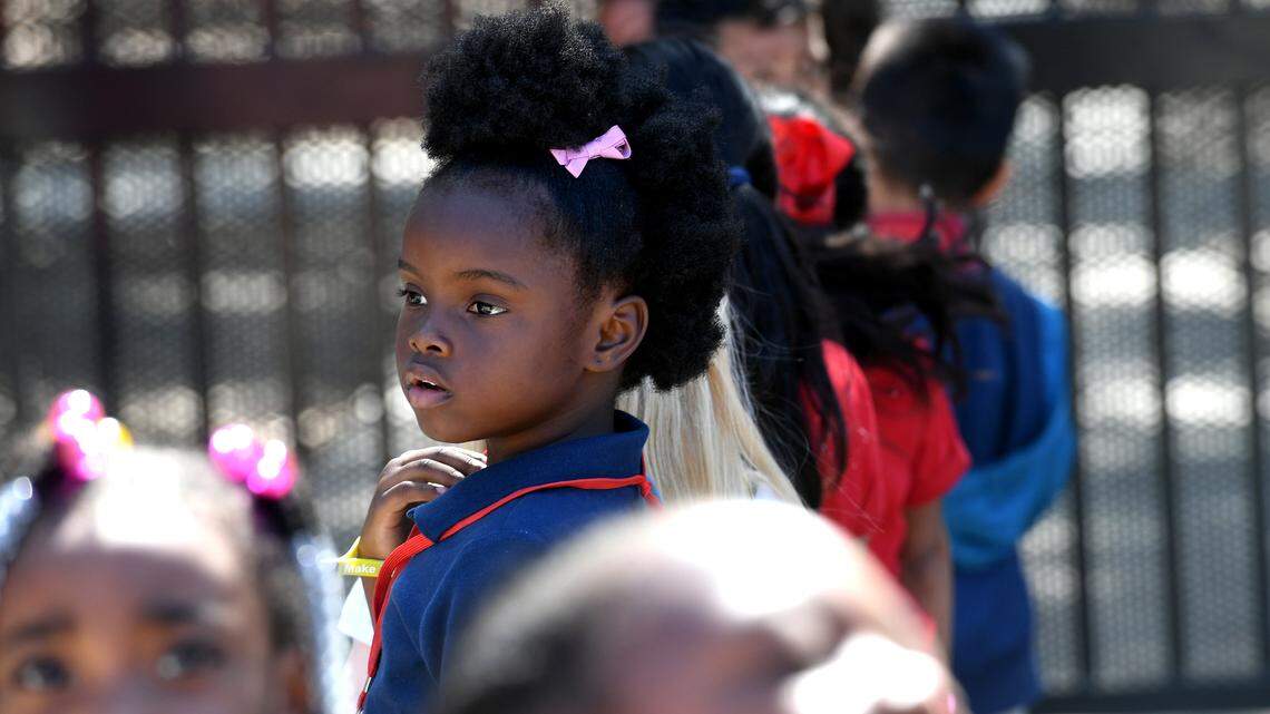 A young student at Manatee Elementary School savors the last moments of recess. The school is a Community school, with a medical center, food pantry, and other supportive services for the students and their families.