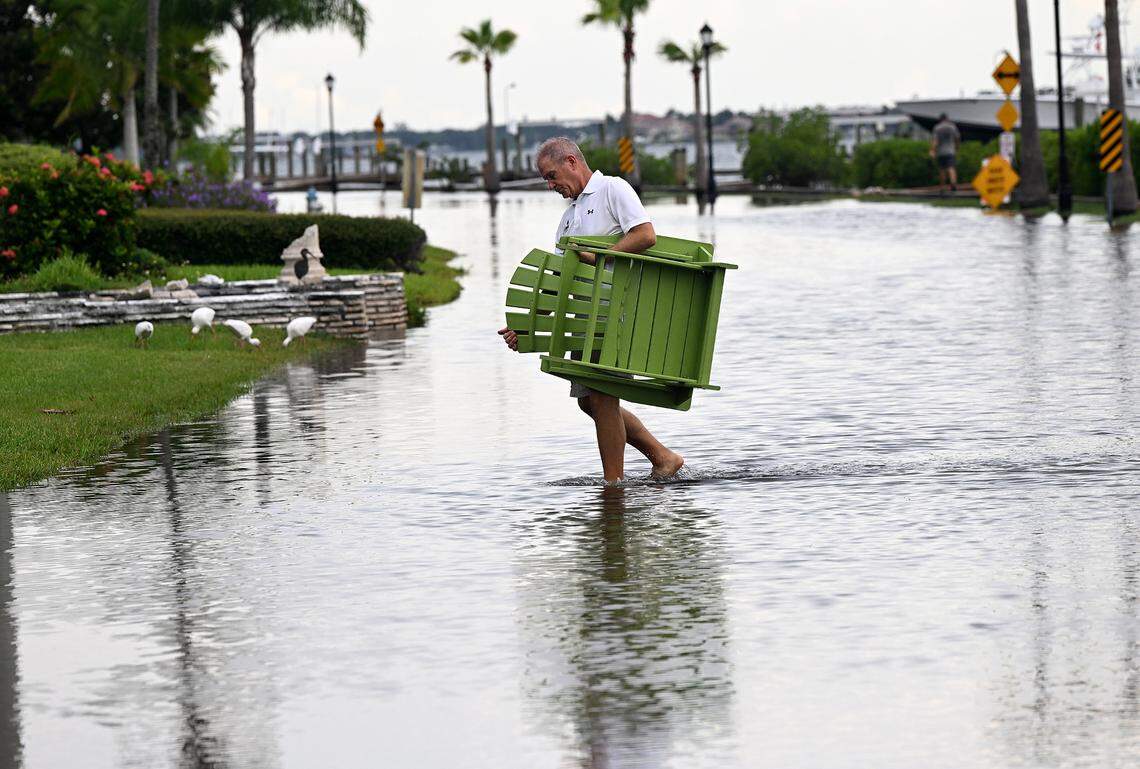 Manatee County officials announced an emergency evacuation order for residents in Zone A, starting Wednesday morning at 10 a.m. as Tropical Storm Helene approaches. Arnie Moshier moves furniture from his dock on Riverview Boulevard in Bradenton as Hurricane Idalia approached on Aug. 29, 2023.