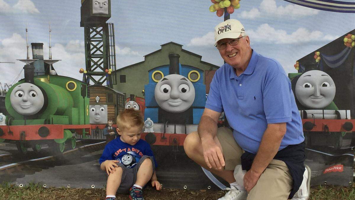 Lakewood Ranch resident Wayne Sternberg loved being a grandfather. He is shown above with a grandson in front of a Thomas the Tank Engine display.
