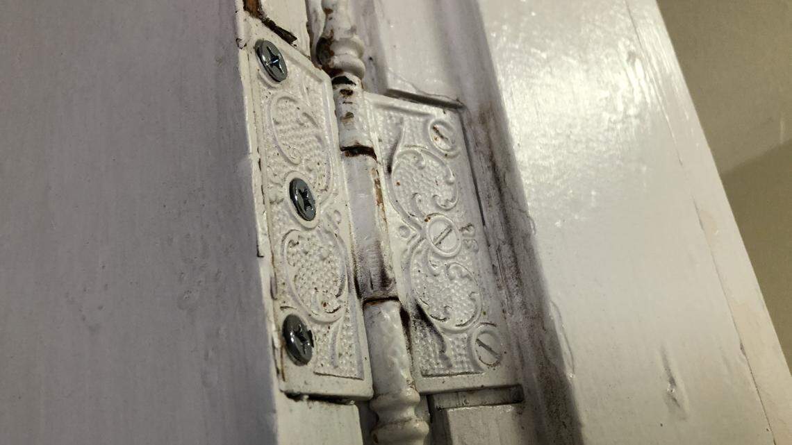 Detail of a door hinge in the Iron Block building, 528 12th St. W., which is on the market for $1.1 million. During its more than 100-year history, the building has housed a candy store, a cigar shop, tailor shop, shoe repair business, legal offices and more. It is called Iron Block because of its decorative pressed metal facade.