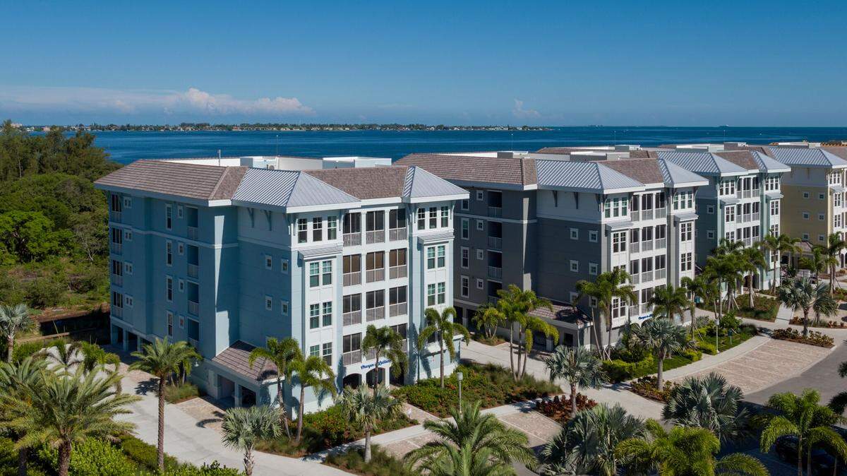 A drone view of One Particular Harbour in Bradenton showing the Margaritaville development's waterfront location.