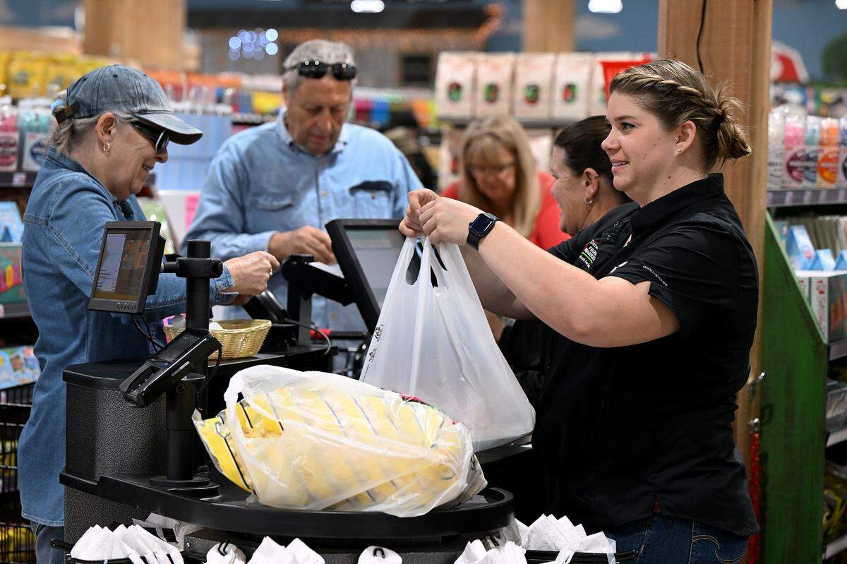 Customers shop at the grand opening of the newest Detwiler’s Farm Market store in Bradenton.