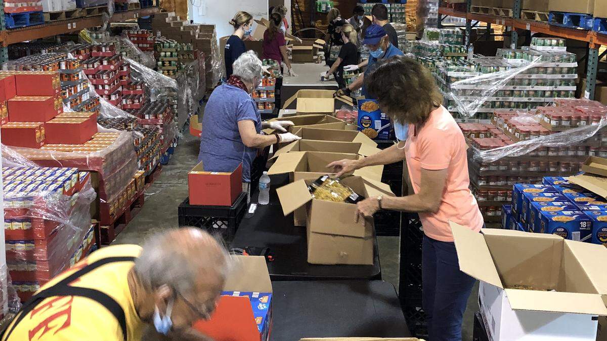 Meals on Wheels PLUS of Manatee volunteers packed food this week that will be distributed to as many as 1,000 families Saturday, June 6, ​at Ellenton Premium Outlets, 5641 Factory Shops Blvd. 