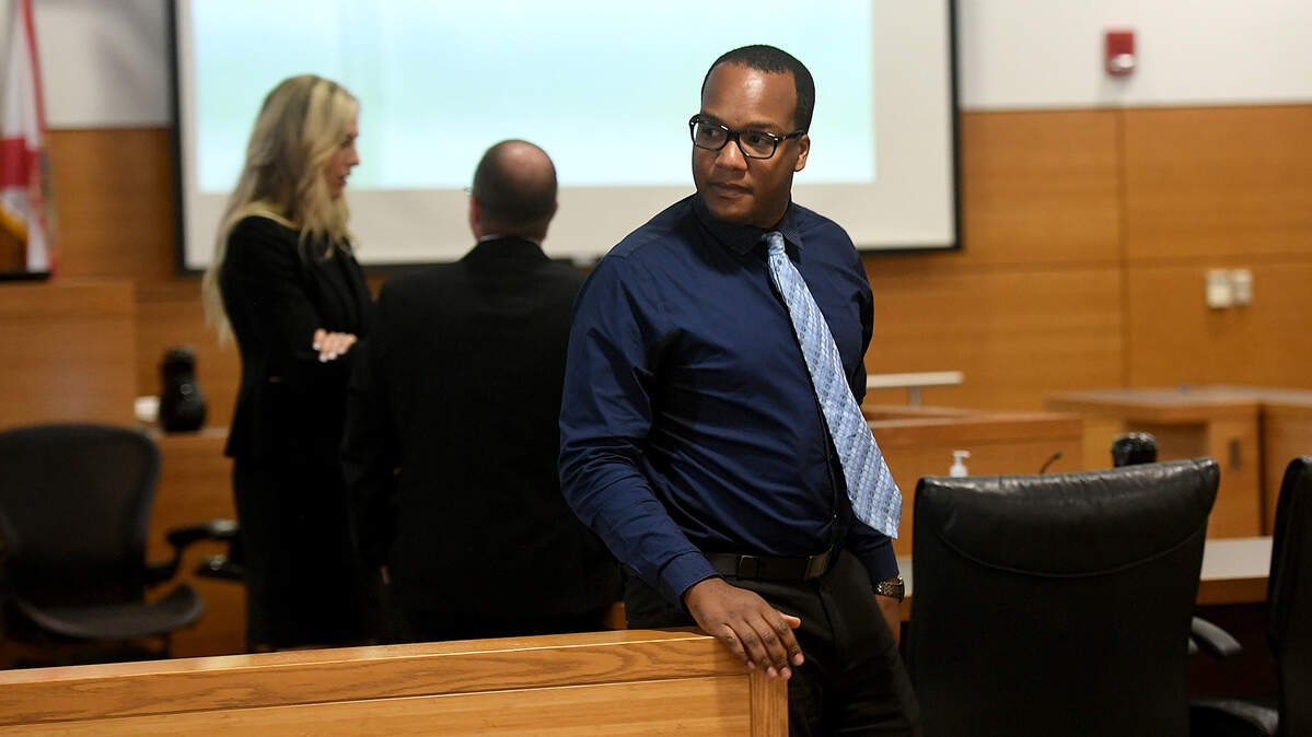 07/21/21—Quentin Peterson stands and speaks with people in the courtroom while the jury deliberates. Peterson, 28, is charged with two counts of possession of child pornography. If convicted as charged, Peterson faces up to 10 years in prison.