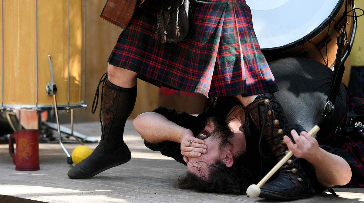 11/14/21—Josh Thompson covers his eyes as the Celtic Legacy performs at the Sarasota Medieval Fair in Myakka Sunday.
