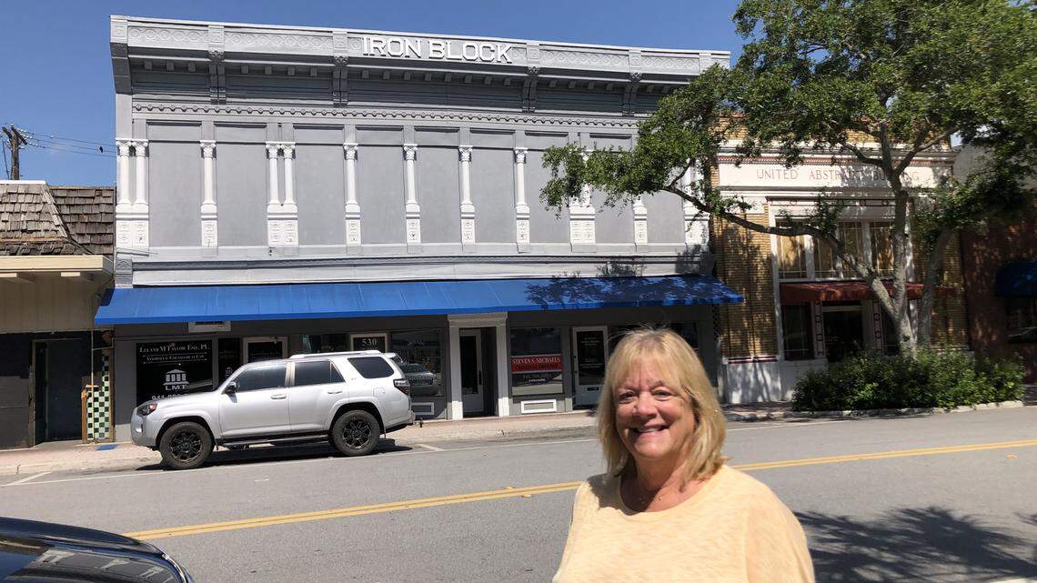 The Iron Block building, 528 12th St. W., is on the market for $1.1 million., with Rae Ellen Hayo (above) the selling agent. During its more than 100-year history, the building has housed a candy store, a cigar shop, tailor shop, shoe repair business, legal offices and more. It is called Iron Block because of its decorative pressed metal facade.