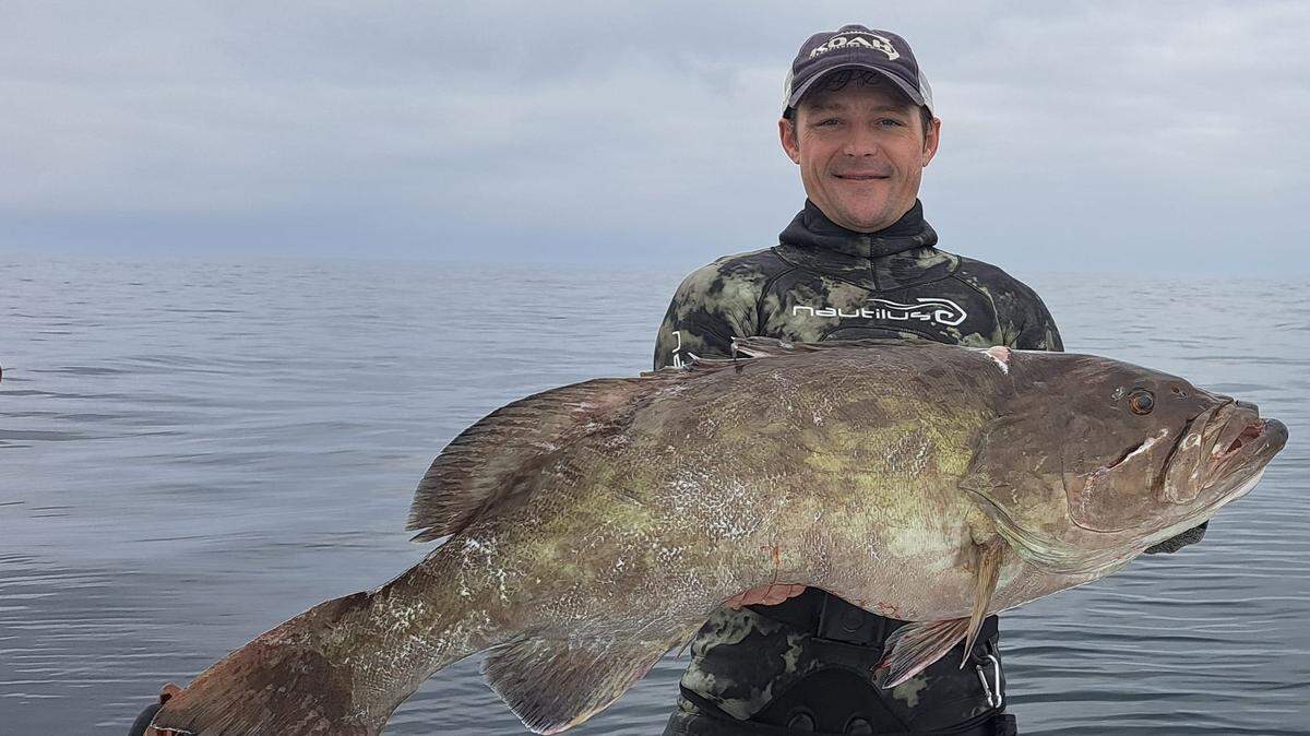 Blake Leigan holds the 41-inch gag grouper he speared.