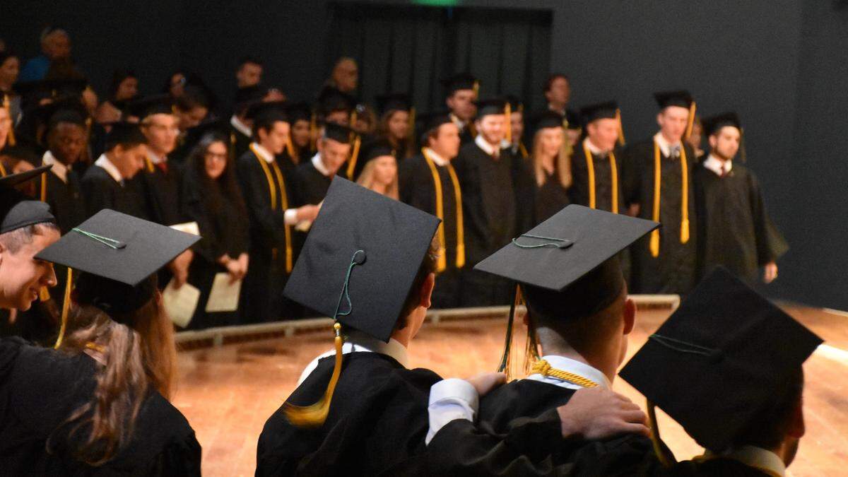 Saint Stephen’s Episcopal School seniors lock arms as they sing the school’s alma mater during the Class of 2019 graduation ceremony.