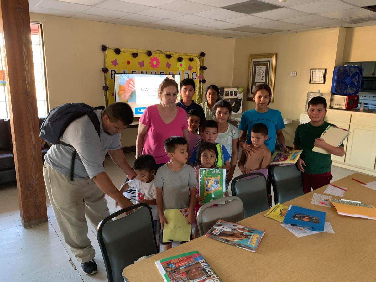 Loredo resident Caridad Sarabia Ramos Cisneros, second from left, created activity books for children of immigrant families temporarily staying at shelters before going to reside with sponsors in the U.S.