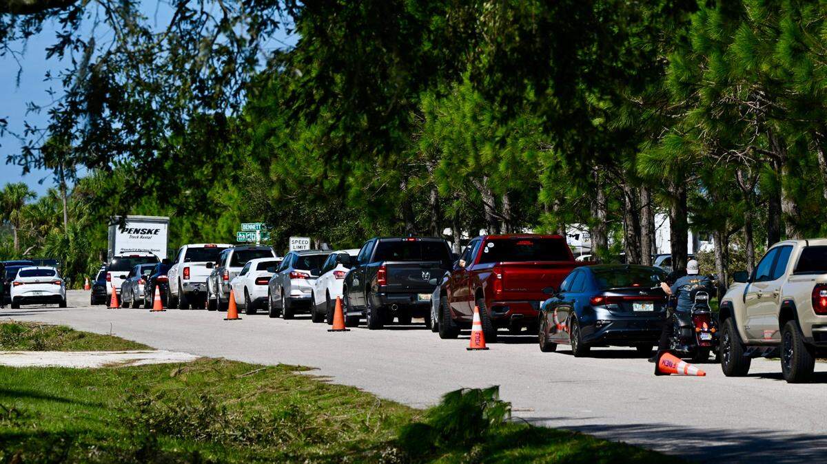 A line of cars sits at a temporary fuel site at Bennett Park, 400 Cypress Creek Blvd., Bradenton, on Saturday, Oct. 12, 2024.
