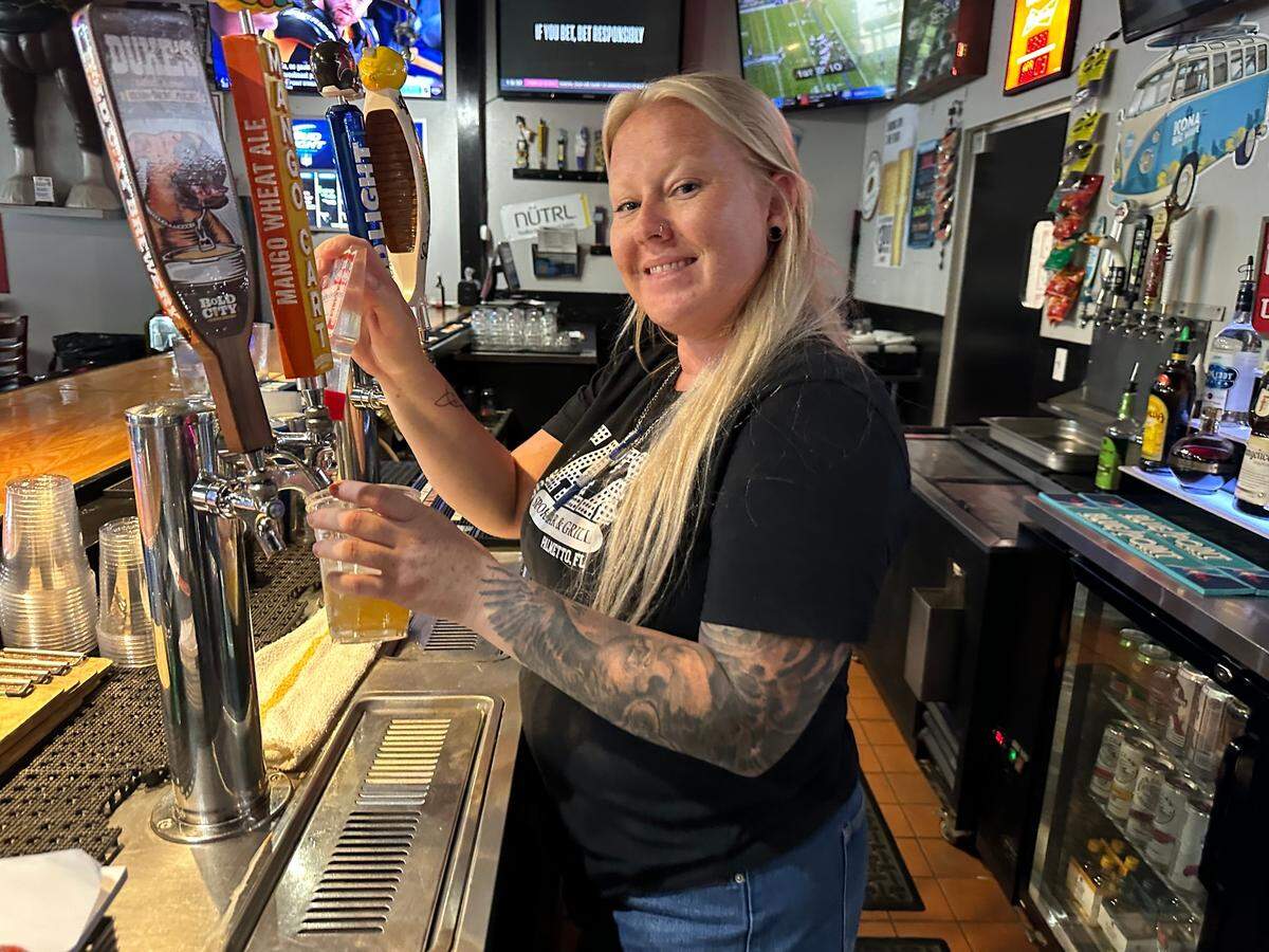 Jessie Johnson tends bar at Jaxx Sports Bar & Grill, 1035 Hasko Road, Palmetto, in Palm Plaza 1.
