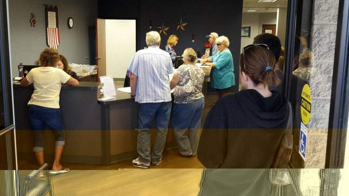 People wait Tuesday at the Manatee County elections office for a chance to register, change their party affiliation or change their address in time for the presidential primary on March 15. The deadline is 5 p.m. Tuesday. Provided photo.