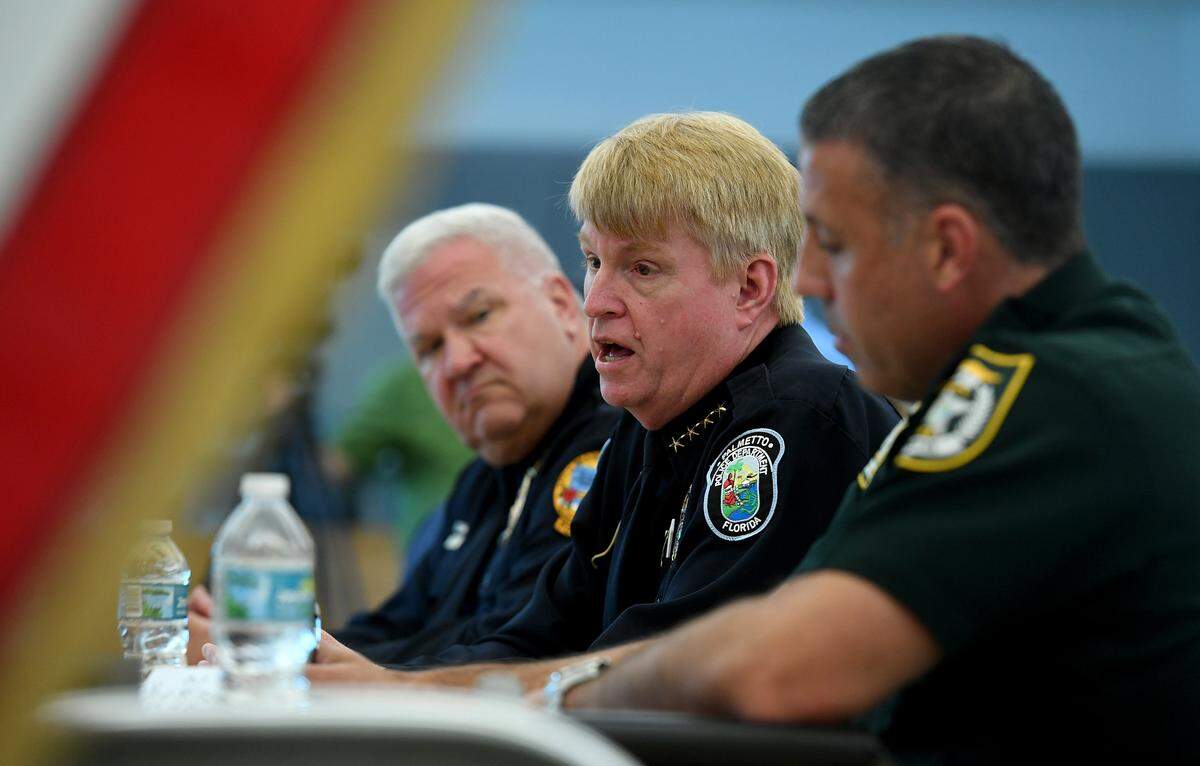Center, Palmetto Police Chief Scott Tyler participates in discussion during a law enforcement roundtable hosted by Congressman Vern Buchanan.