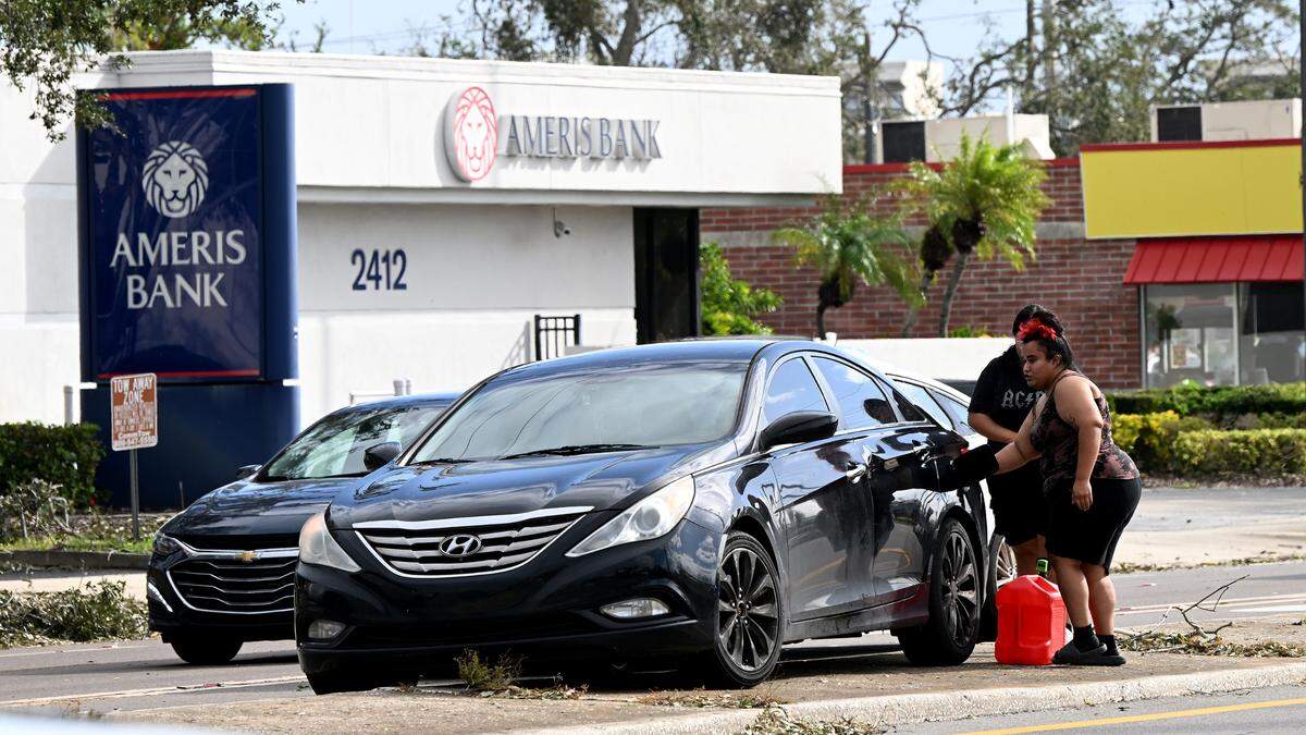 A motorist ran out gas in front of the Wawa at 2509 Cortez Road where lines were forming after Hurricane Milton on Oct. 11, 2024.