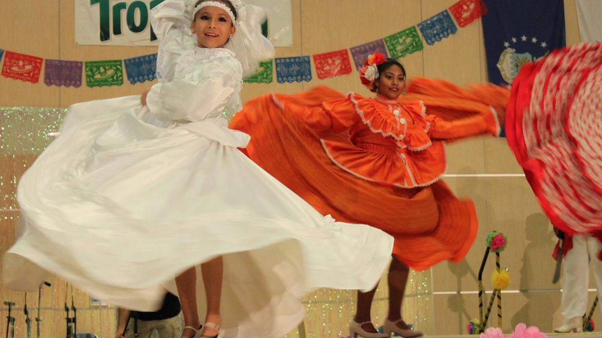 Claudia Fajardo and Evelyn Arteaga enjoy the Hispanic Heritage Festival at Manatee Technical College. More than 1,000 attended the 16th annual event Oct. 17.PHOTO PROVIDED