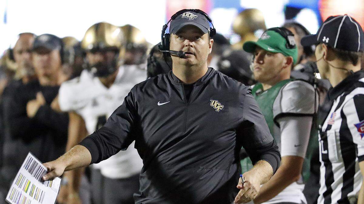 UCF head coach Josh Heupel watches a replay on the scoreboard during the first half of Saturday’s victory against East Carolina.