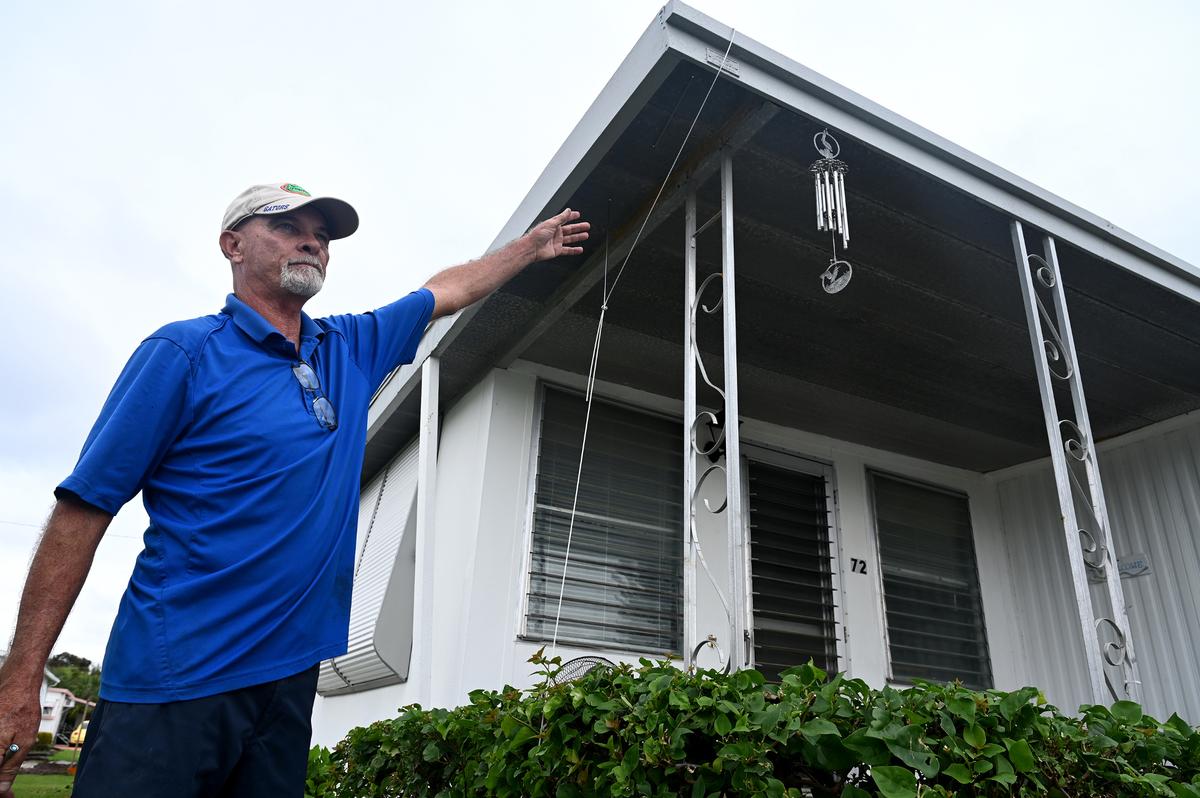 Pat O’Connor, 63, of Royal Garden Estates, is preparing to evacuate for the first time as Hurricane Milton approaches Manatee County on Oct. 7, 2024. O’Connor added cables from the corners of his mobile home to the ground for added stability.