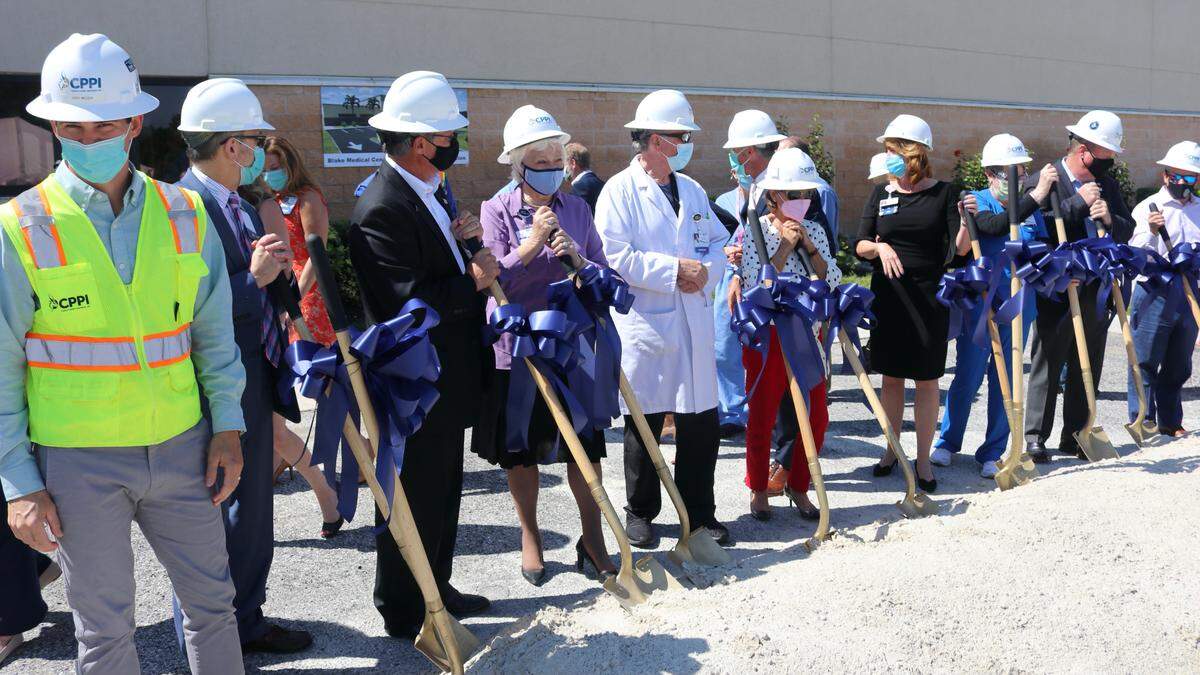 4/8/2021--The first shovels of sand were tossed on Thursday for the next expansion of Blake Medical Center, bringing more operating rooms and intensive care beds to the hospital.