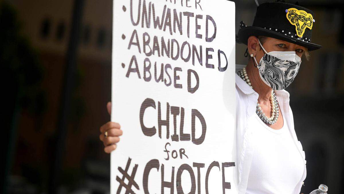09/14/21—Denise Ruggiero holds a sign as protestors rally outside the county’s Administrative Center in downtown Bradenton Tuesday morning. Inside the building, the Board of County Commissioners planned to send a letter to Ashley Moody in hopes of putting local abortion restrictions in place.