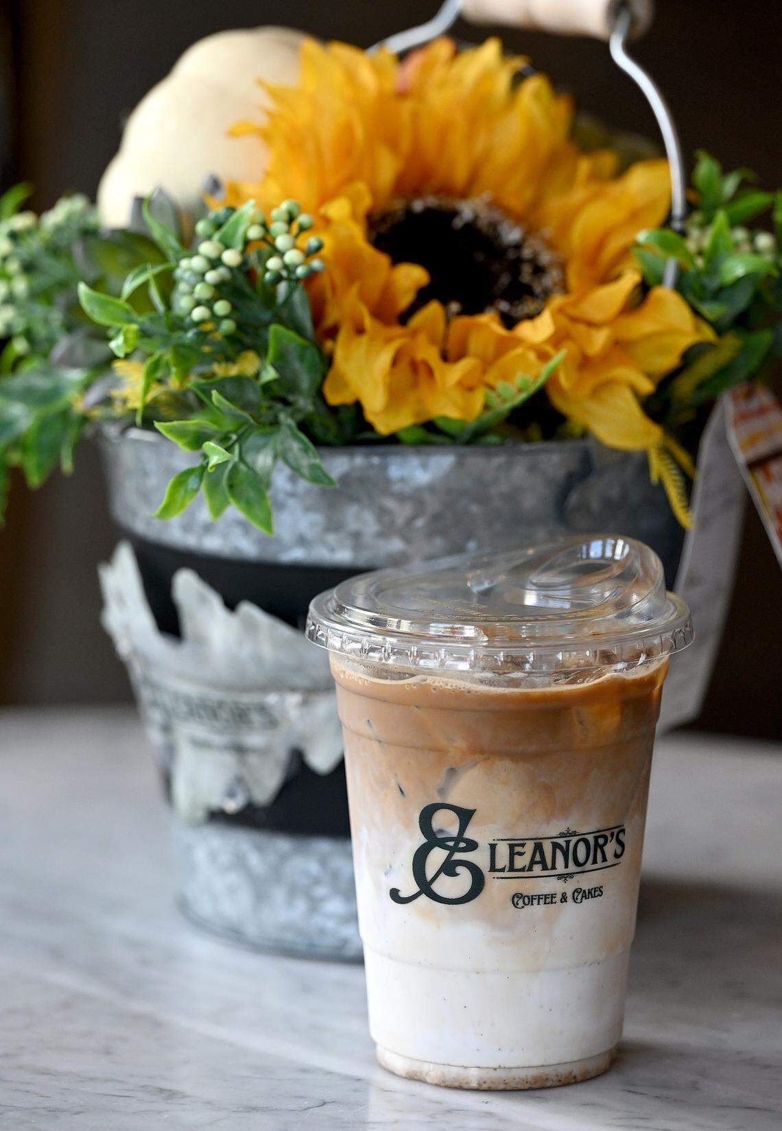 An iced apple-pumpkin coffee at the newly-opened Eleanor’s Coffee and Cakes in Palmetto’s historical State Bank building on 10th Avenue West on Oct. 21, 2025.