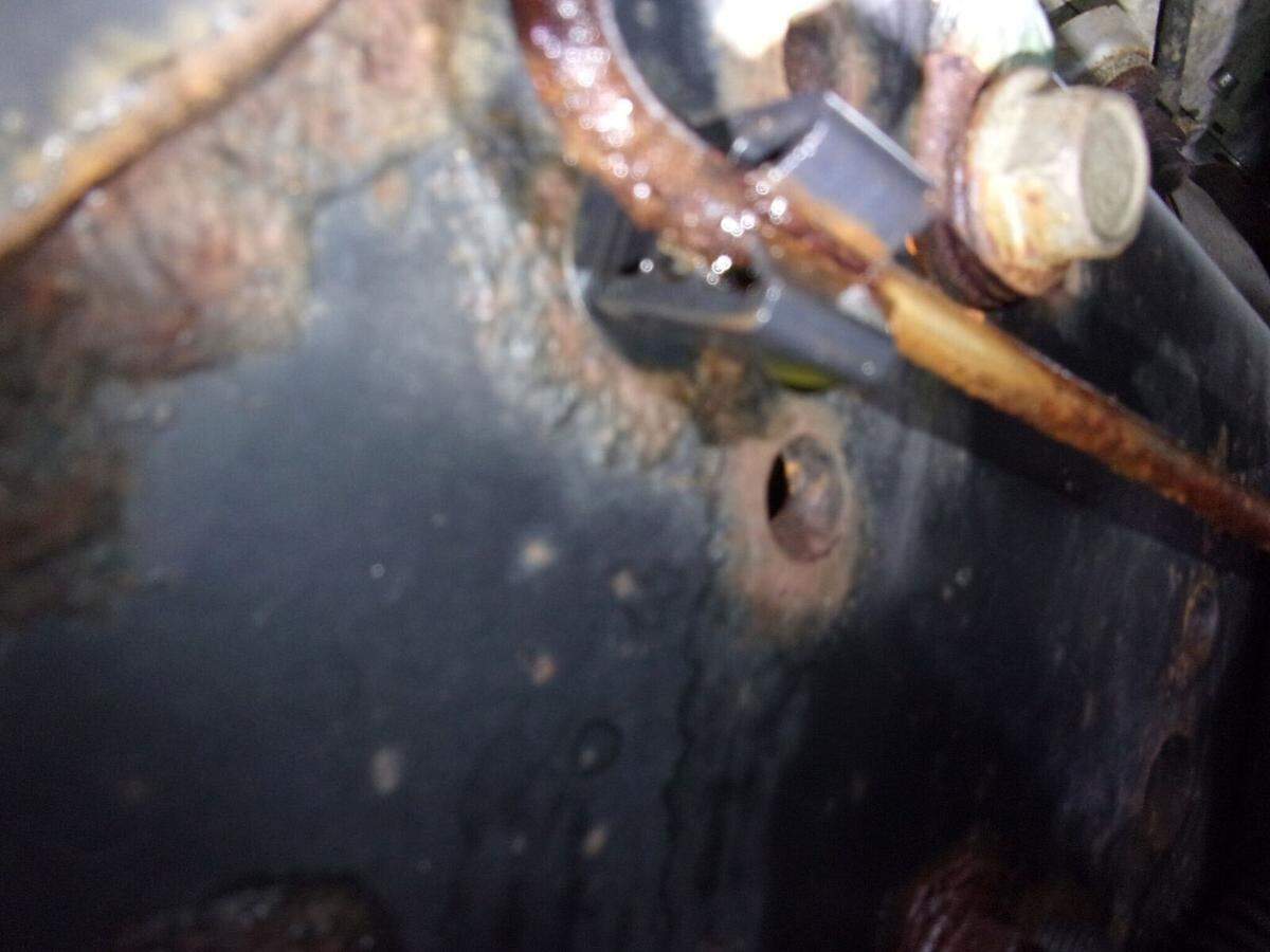 Bradenton Ward 4 candidate Bill Sanders claims his brake lines were cut by his opponent, but police photos show extensive wear on his lines. Police found no evidence of tampering, but did discover a hole that rusted out in one of the lines and was leaking brake fluid. This photo shows where the leak was oozing from the rusty line.