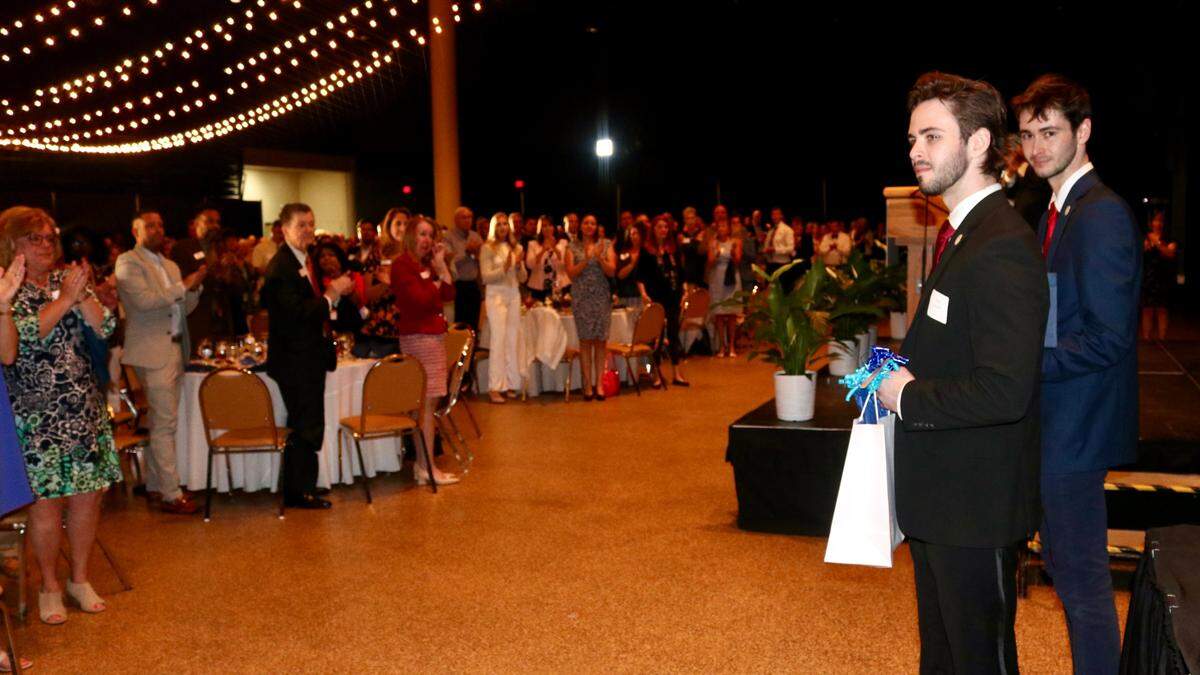 Ian and Evan Sharff received a standing ovation after accepting the Charles Clapsaddle Community Spotlight Award on behalf of their late father, Paul Sharff, March 30, 2022, during the Spirit of Manatee awards presented by the Manatee Community Foundation at the Bradenton Area Convention Center in Palmetto.