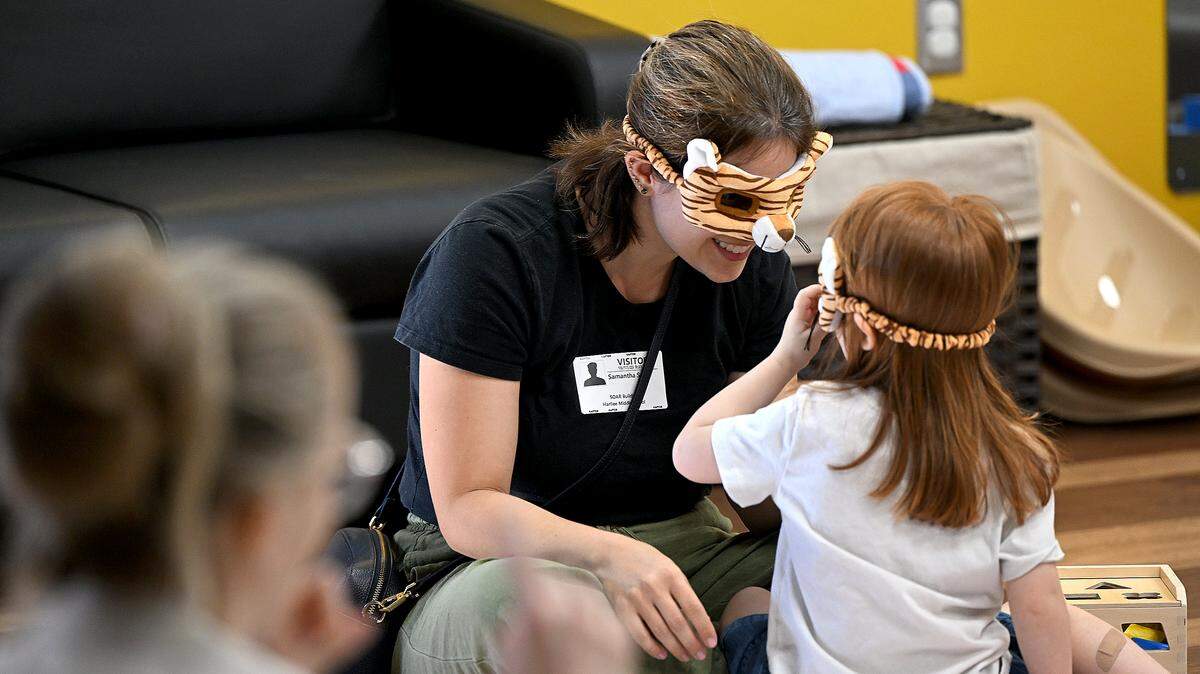 Samantha Smith and Emma, 3, enjoy story time at the Soar Lab, which recently opened in Manatee County's Sara Scott Harllee Center. They provide families with hands-on learning experiences that are tied to early development learning standards shown on Friday, Oct. 17, 2025.