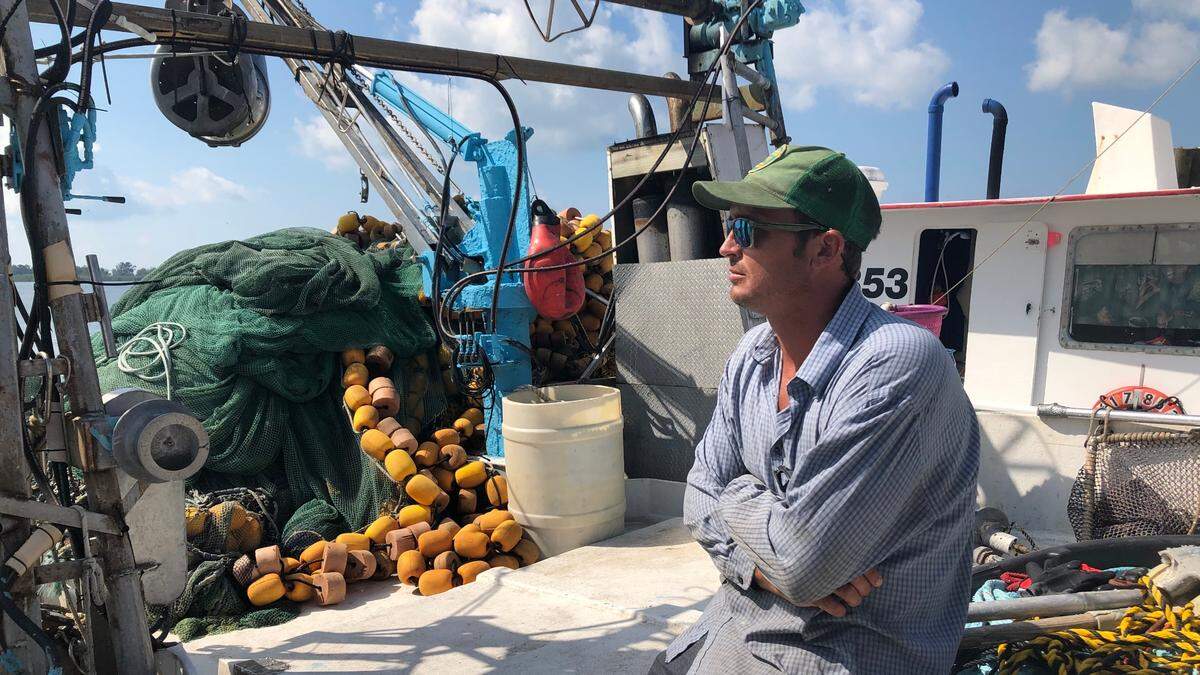 Nathan Meschelle, 29, owner-operator of the “High Roller,” supplies thread herring, roe mullet and stone crabs to the docks of Cortez.