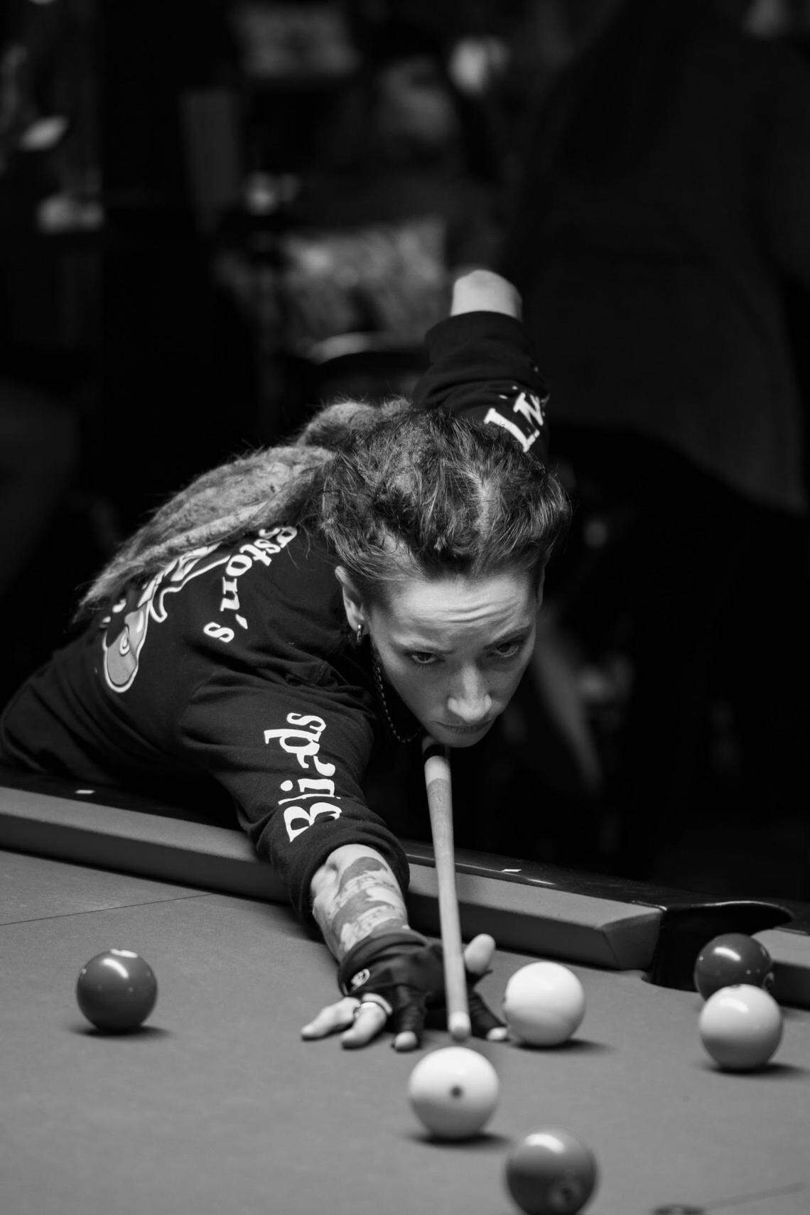Manatee County’s Taylor Marlow lines up a shot in preparation for the World Billiards Championship in Las Vegas, which starts Thursday, August 8, 2024. Marlow is competing with her Manasota APA team called the Young Guns.