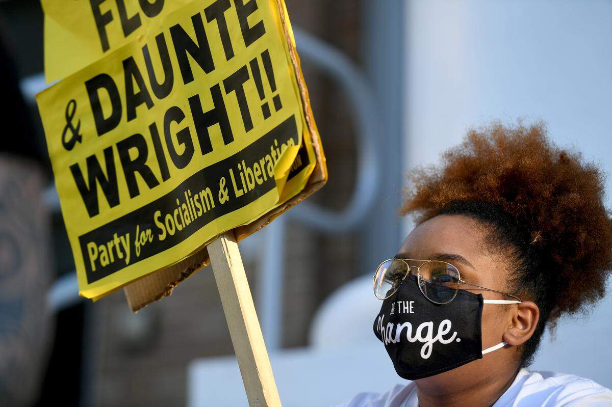 04/21/21--Zaire Kekahuna-Samedi holds a sign at a rally at the steps of the Manatee County Courthouse to observe the jury verdict that found former police officer Derek Chauvin guilty of murder and manslaughter in the killing of George Floyd.