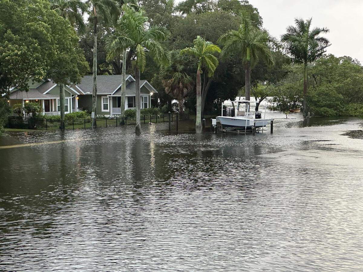 City of Bradenton workers closed parts of Virginia Drive along Wares Creek after Hurricane Idalia created flood waters making the road impassable on Wednesday, Aug. 30, 2023.