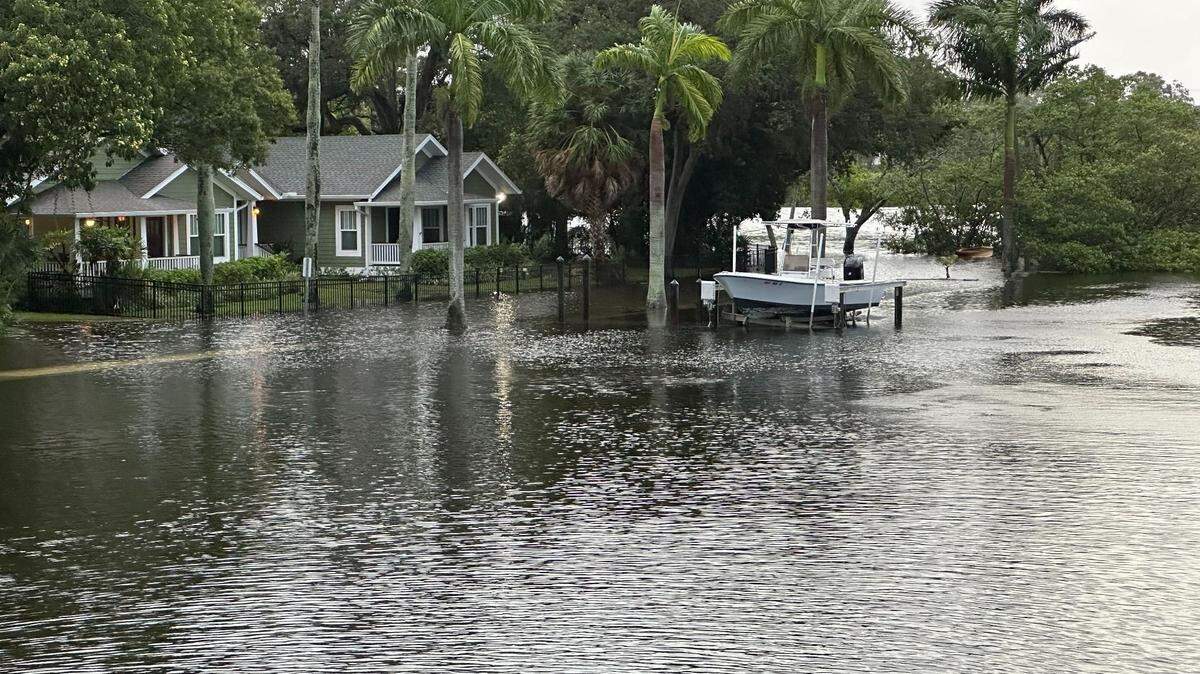 City of Bradenton workers closed parts of Virginia Drive along Wares Creek after Hurricane Idalia created flood waters making the road impassable on Wednesday, Aug. 30, 2023.