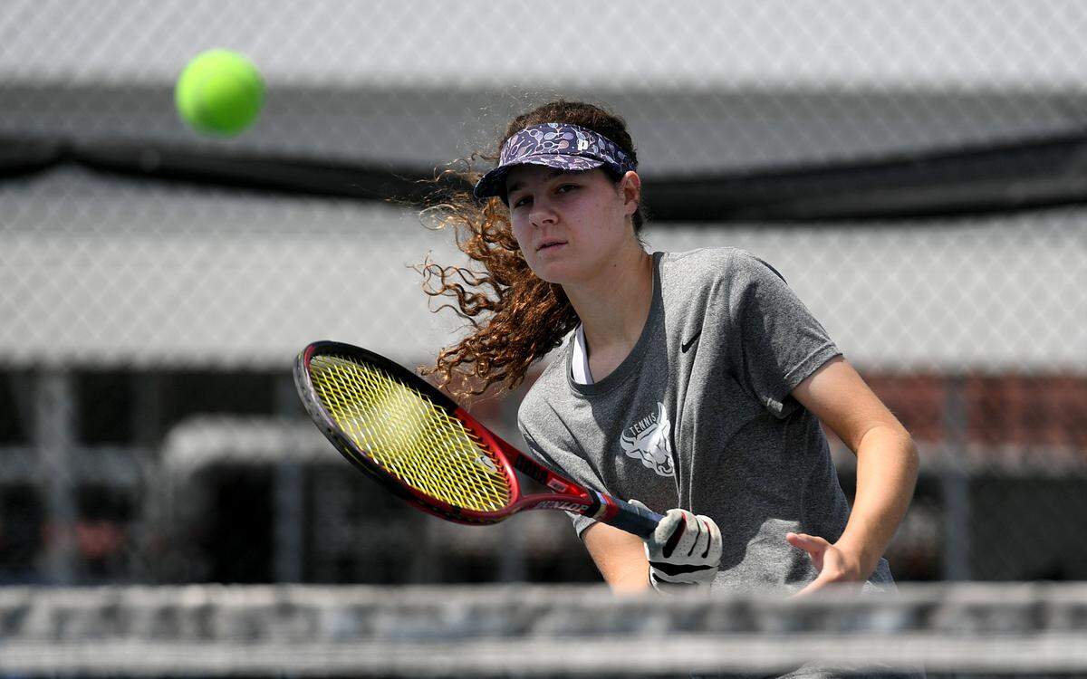 Odessa Eisch, 18, is a top tennis player at the Parrish Community School going to compete at states.