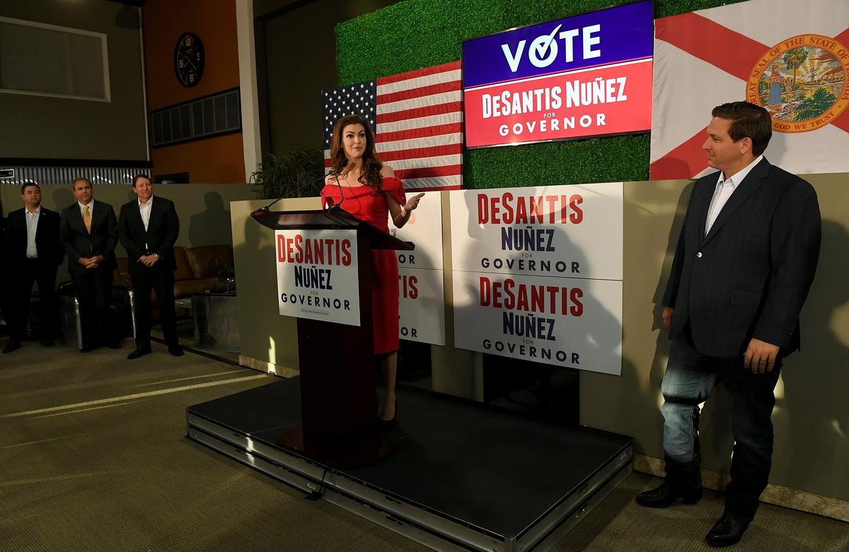 Casey DeSantis introduces her husband, Ron DeSantis, during a campaign rally stop at Dolphin Aviation Wednesday morning.