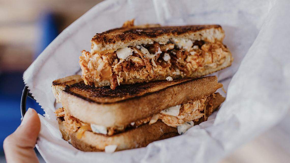 The buffalo chicken grilled cheese sandwich at Food + Beer, 4804 14th St. W., Bradenton, includes sourdough bread, buffalo chicken, cheddar, bleu cheese, and tobacco fried onions.