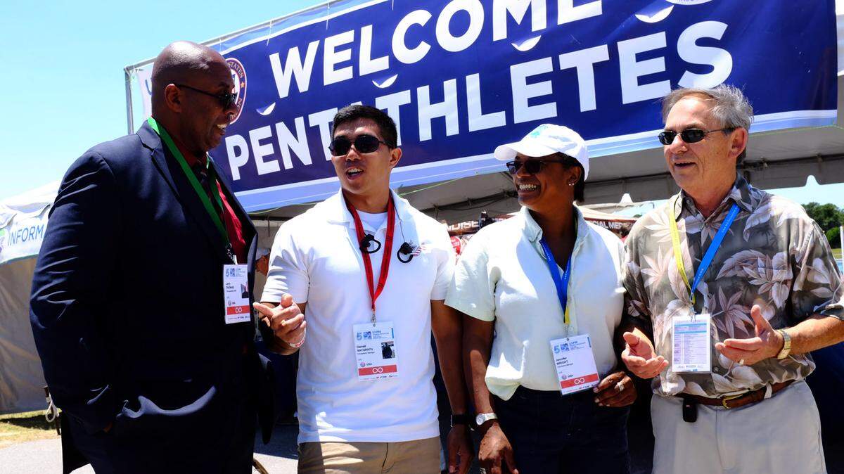 Veterans Larry Thomas, Darrell Xayarath, Jennifer Wright and Gerry Vonopal work at the Modern Pentathlon 2016 UIPM World Cup Final on Saturday at Nathan Benderson Park in Sarasota. 
 GRANT JEFFERIES/Bradenton Herald