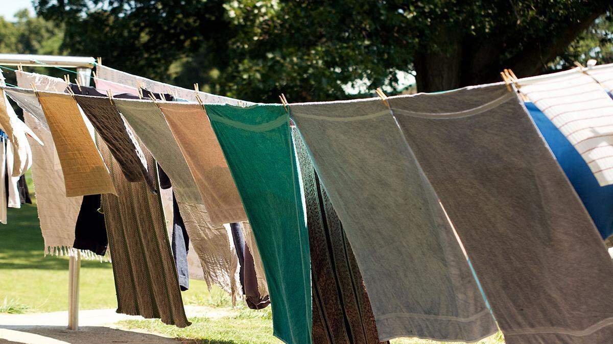 Lovina Eicher enjoyed granddaughter Abigail’s help hanging laundry outside to dry.