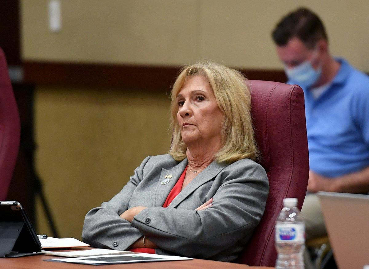 Vanessa Baugh listens with members of the Manatee County Commission as they gather at the Bradenton Area Convention Center to decide upon a mask wearing resolution.