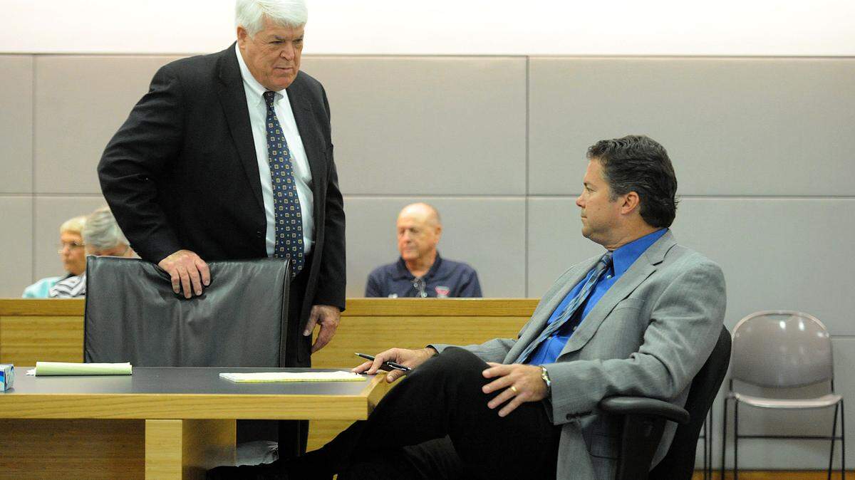 Attorney John Romano with his client, Robert Gagnon during a hearing at the judicial center to hear a motion by the school board to dismiss Gagnon's lawsuit. 
 TIFFANY TOMPKINS/Bradenton Herald