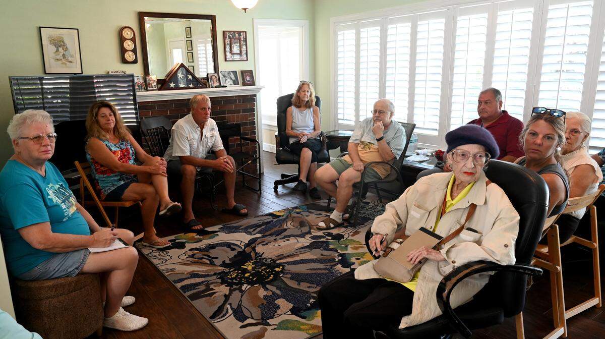 Neighbors meet at the home of Robert and Linda Seybold to discuss the City of Bradenton’s plans to build a temporary lift station to replace a failing one in use since the 1950s on land at 2052 Riverside Drive E. in Bradenton, formerly the home of Councilman Bill Sanders.