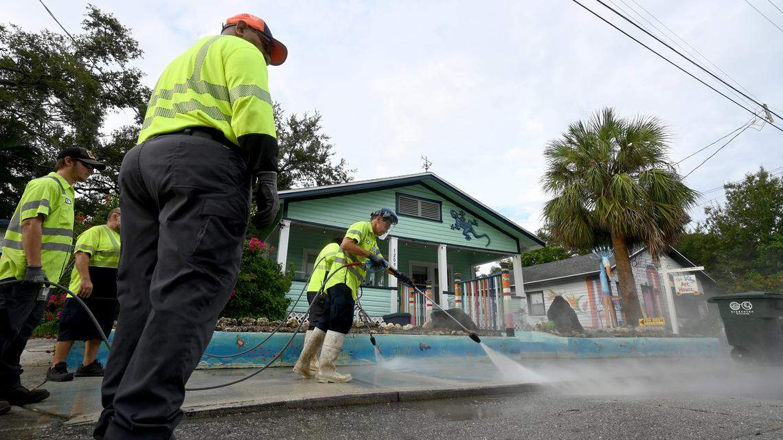 City of Bradenton employees were busy pressure washing the art from the sidewalks on 12th Avenue West in the Village of the Arts on Wednesday, Aug. 27, 2025. The city said in a release that it is “fully complying with FDOT’s order and is working to complete the required removals by the September 4 deadline.”