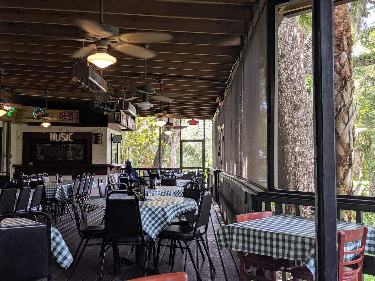 Catch live music every Saturday and Sunday on the back porch at Linger Lodge.