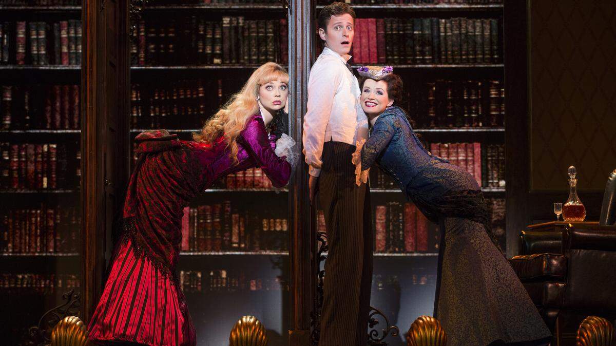 From left, Kristen Beth Williams as Sibella Hallward, Kevin Massey as Monty Navarro and Adrienne Eller as Phoebe D'Ysquith star in a scene from "A Gentleman's Guide to Love and Murder." JOAN MARCUS PHOTO