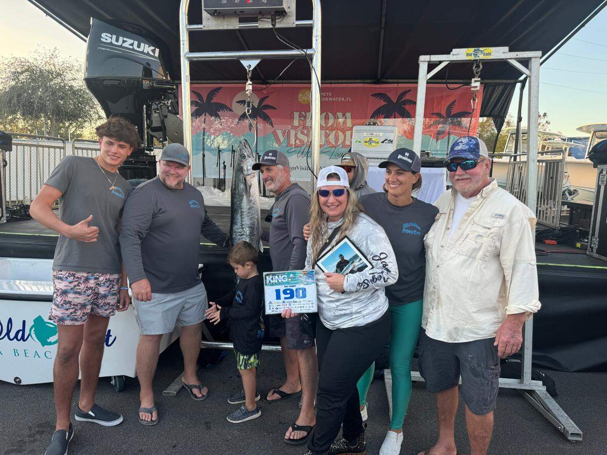 Team 99 Problems — Lukas Ramalho, Brian Hasson, Wyatt Hasson, Mike Layton, Annie Gell, Stella Bernardi and Billy Hasson — pose with their winning kingfish.