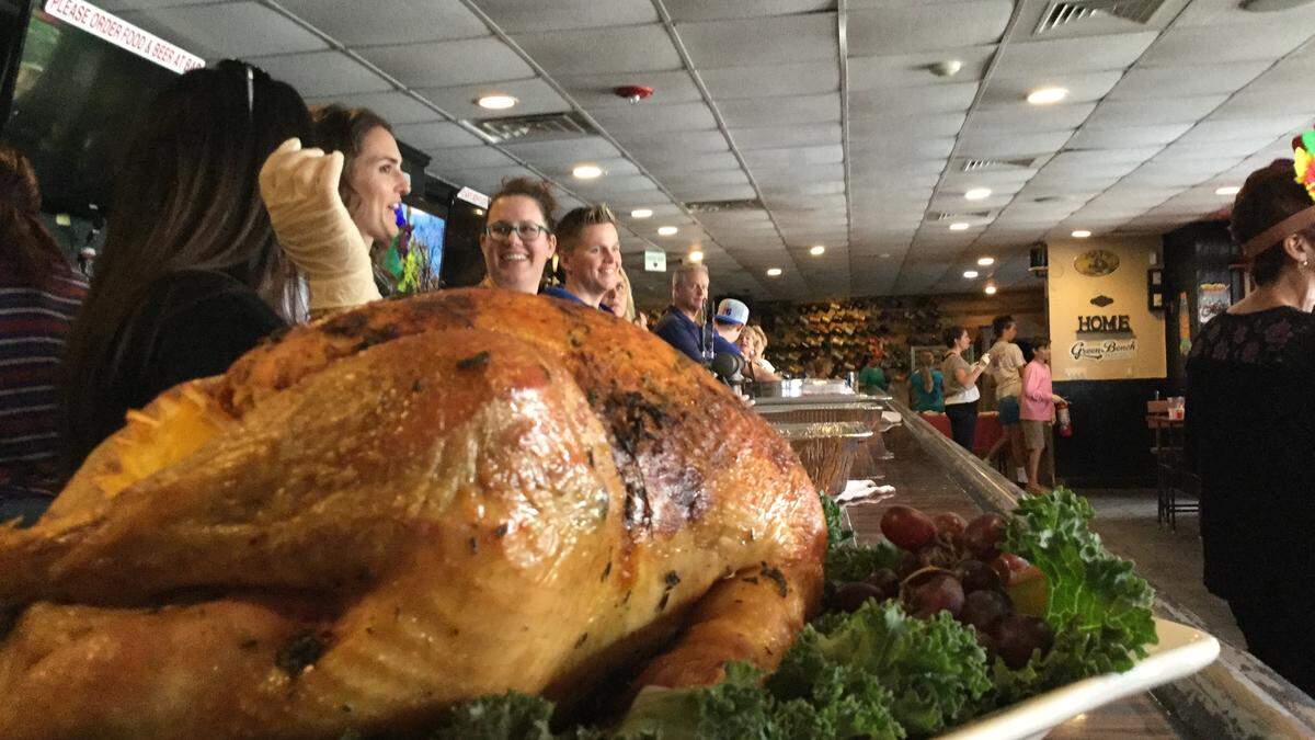 Volunteers were all smile at 3 Keys Brewery and Eatery on Thanksgiving morning as they prepared to feed about 250 people a free holiday dinner. The craft beer establishment is celebrating its second anniversary in business and co-owner Cathy Douglas said they’ve been blessed by a supportive community and wanted to do something to give back.