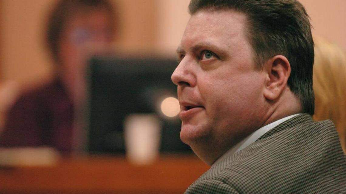 Joseph Smith looks at his lead attorney Adam Tebrugge Thursday, Nov. 10, 2005, during Smith's trial at the Sarasota County Judicial Center in Sarasota,.