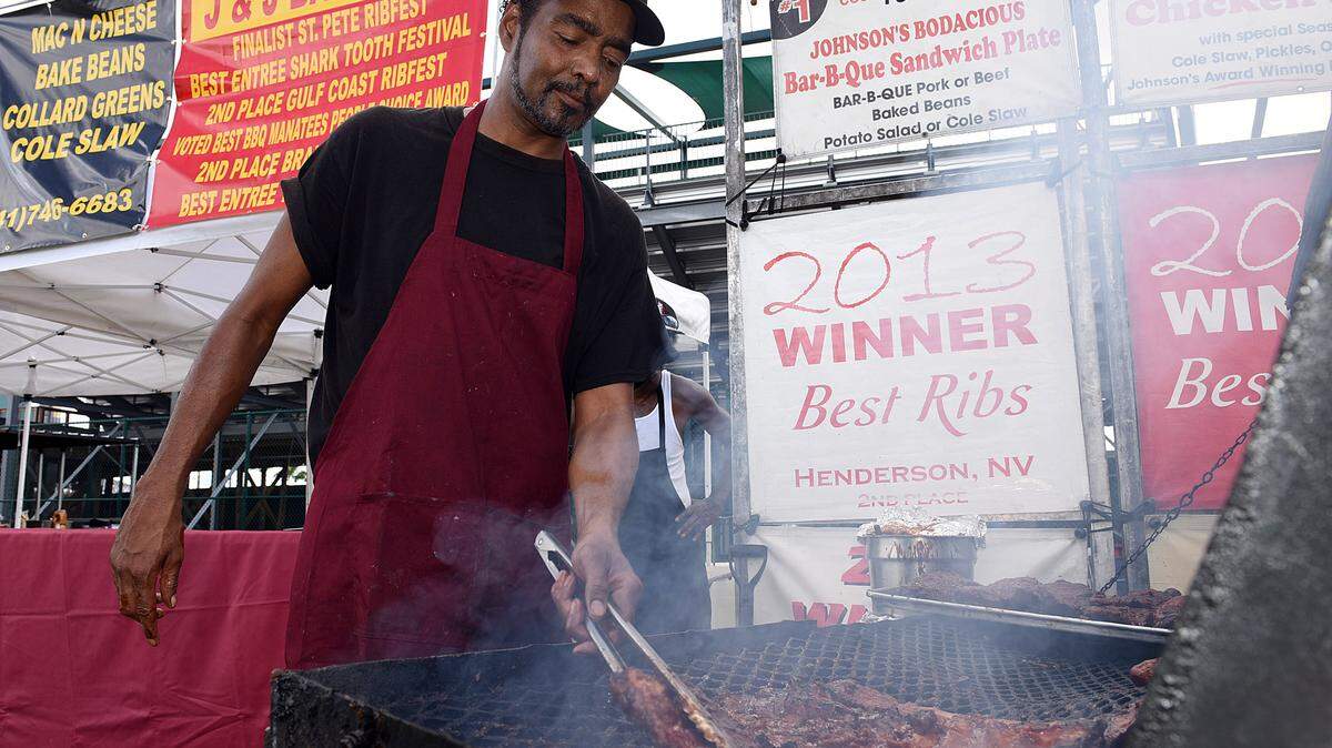 Kevin Williams of Johnson's Bar-B-Que from Virginia cooks ribs Friday afternoon in preparation for the Gulf Coast Rhythm & Ribs Music Fest held in the parking lot of McKechnie Field. The festival kicks off Friday evening at 5p.m.TIFFANY TOMPKINS-CONDIE/Bradenton Herald